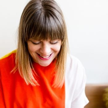 lady laughing looking down on photoshoot for her personal branding